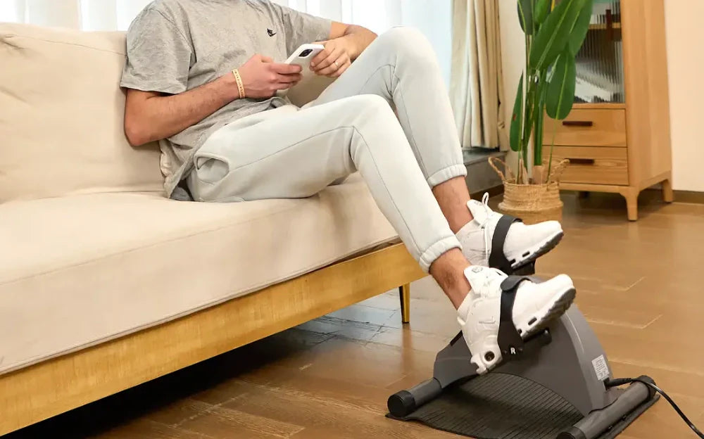 exercising with mini exercise bike while using mobile phones