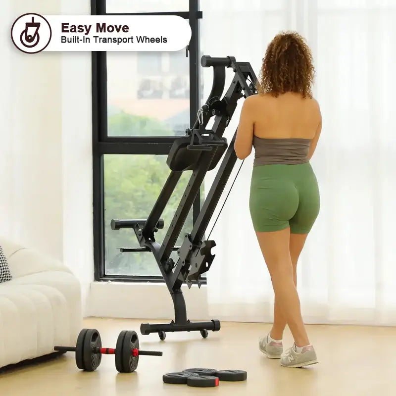 Woman using a cable machine with transport wheels in a room with large windows.