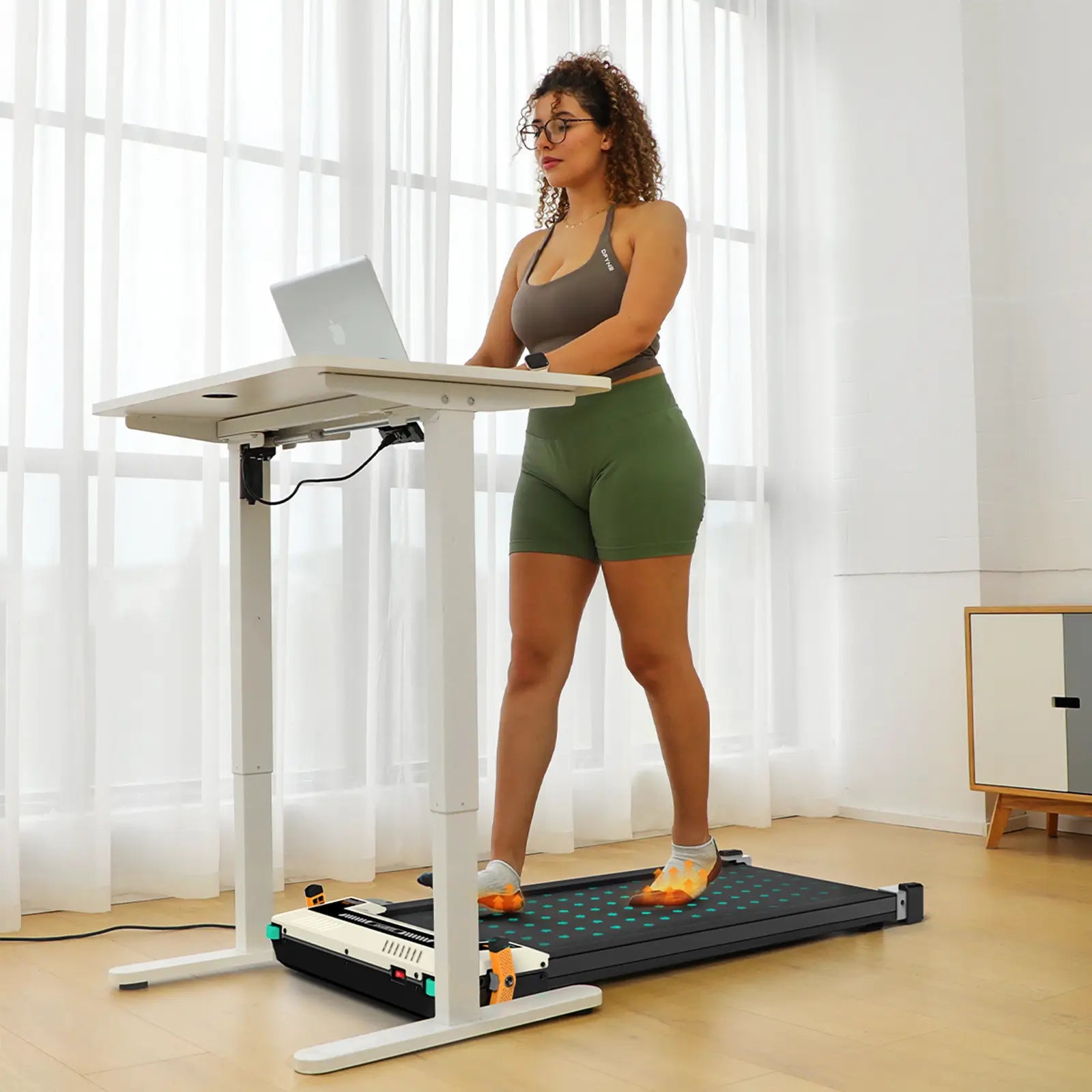 Tousains mini treadmill for home with massage function can be placed under the desk and allows multitasking.