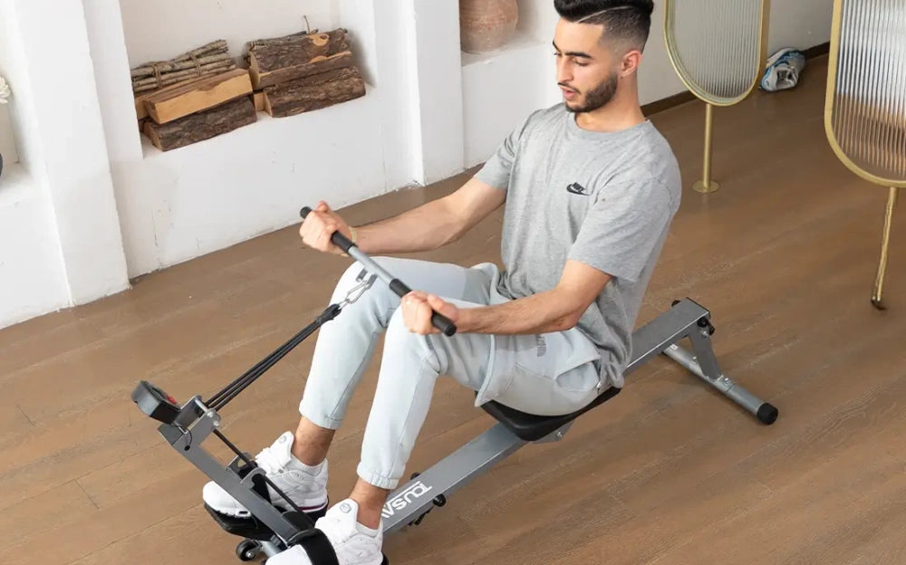 exercising with Tousains foldable rowing machine at home