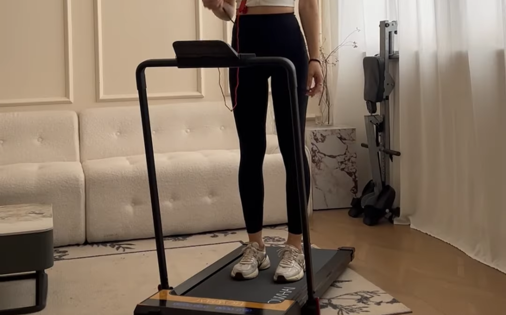 standing on the treadmill and prepare for the HIIT workout