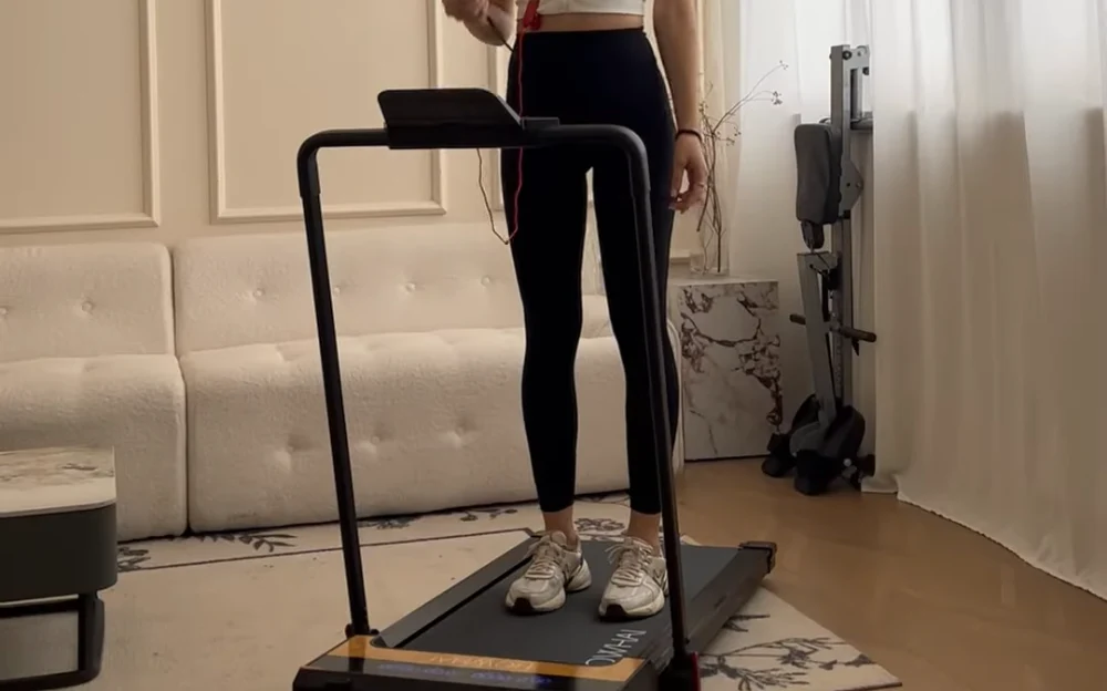 standing on the treadmill and prepare for the HIIT workout