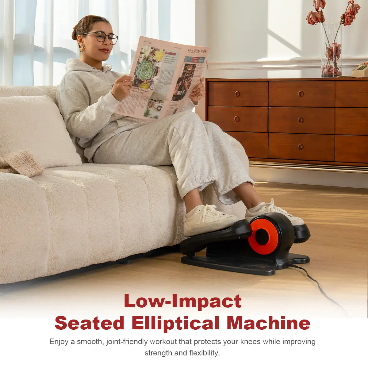 Using Tousains electric elliptical machine while reading newspaper